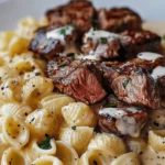 Steak Bites and Shell Pasta in Garlic Butter Alfredo Sauce